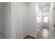 Bright hallway features wood floors and multiple closets for ample storage at 280 Chesapeake Commons St # 151, Garner, NC 27529