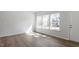 Bright living room featuring hardwood floors and natural light from large windows at 280 Chesapeake Commons St # 151, Garner, NC 27529