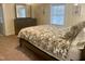 Cozy bedroom featuring a queen bed and floral-patterned bedding at 321 W Chatham St, Cary, NC 27511