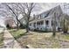 Two-story home with a front porch and trees, showcasing its inviting curb appeal and traditional architectural style at 321 W Chatham St, Cary, NC 27511