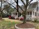 Charming traditional home with a cozy front porch and beautiful landscaping at 321 W Chatham St, Cary, NC 27511