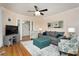 Cozy living room with hardwood floors, neutral walls, and a ceiling fan, offering an inviting gathering space at 321 W Chatham St, Cary, NC 27511