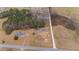 Aerial view of a home with fenced pasture land with horses, bordered by a road at 3405 Wilsons Mills Rd, Smithfield, NC 27577