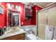 Bathroom featuring a toilet, mirror, sink and standing shower stall at 3405 Wilsons Mills Rd, Smithfield, NC 27577