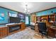 Home office with wood floors, natural light, and a sliding barn door at 3405 Wilsons Mills Rd, Smithfield, NC 27577