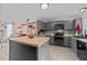 The kitchen features gray cabinets, an island, and stainless steel appliances at 3405 Wilsons Mills Rd, Smithfield, NC 27577