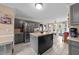 The kitchen features gray cabinets, an island, and stainless steel appliances at 3405 Wilsons Mills Rd, Smithfield, NC 27577