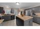 The kitchen features gray cabinets, an island, and stainless steel appliances at 3405 Wilsons Mills Rd, Smithfield, NC 27577