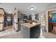 The kitchen features gray cabinets, an island, and stainless steel appliances at 3405 Wilsons Mills Rd, Smithfield, NC 27577