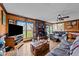 Cozy living room with brick fireplace, wood floors and lots of light at 3405 Wilsons Mills Rd, Smithfield, NC 27577