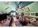 Cozy attic living room with a quirky green color scheme, ceiling fan, and wood floors at 3405 Wilsons Mills Rd, Smithfield, NC 27577