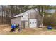 Outbuilding features a garage door and additional entrance at 3405 Wilsons Mills Rd, Smithfield, NC 27577