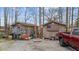 Two outbuildings with patriotic decor and ladders. A truck is visible in the frame at 3405 Wilsons Mills Rd, Smithfield, NC 27577