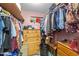 Well-organized walk-in closet with wooden shelving and a neutral color scheme at 3405 Wilsons Mills Rd, Smithfield, NC 27577