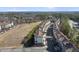 A high angle view shows a row of townhomes located on a corner lot with mature landscaping and a long street at 342 View Dr, Morrisville, NC 27560