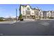 Eye-level view of a three-story townhome featuring private garage and architectural design elements at 342 View Dr, Morrisville, NC 27560