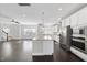 Modern kitchen with stainless steel appliances, granite counters, and a central island, flowing into the living area at 342 View Dr, Morrisville, NC 27560