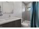 Functional bathroom featuring a combined shower and tub, modern sink and neutral tones at 38 Kingbird Ln, Chapel Hill, NC 27517