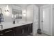Well-lit bathroom featuring a modern vanity with ample storage, stylish lighting, and a clean, functional design at 38 Kingbird Ln, Chapel Hill, NC 27517