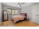 Cozy bedroom with hardwood floors, a large window, and a comfortable bed, perfect for relaxation at 38 Kingbird Ln, Chapel Hill, NC 27517