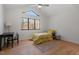 Bright bedroom featuring hardwood floors, natural light from the window, and a cozy, inviting atmosphere at 38 Kingbird Ln, Chapel Hill, NC 27517