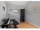 Minimalist bedroom with hardwood floors, natural light, and ample space for musical pursuits at 38 Kingbird Ln, Chapel Hill, NC 27517