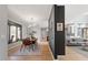 Open concept living space features a modern dining area with sleek lighting, and hardwood floors throughout at 38 Kingbird Ln, Chapel Hill, NC 27517