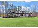 Exterior elevation of modern farmhouse showing a large yard at 38 Kingbird Ln, Chapel Hill, NC 27517