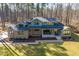 A front exterior elevation of home showing a covered porch and manicured lawn at 38 Kingbird Ln, Chapel Hill, NC 27517
