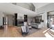Bright living room boasts a modern fireplace, hardwood floors, and an open floor plan at 38 Kingbird Ln, Chapel Hill, NC 27517