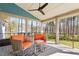 Relax on this covered porch with chairs and forest views, perfect for outdoor enjoyment at 38 Kingbird Ln, Chapel Hill, NC 27517