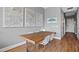 Cozy dining room with a wooden table, modern chairs, and Raleigh city maps on the wall at 400 W North St # 804, Raleigh, NC 27603