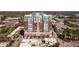 Stunning aerial view of a modern, multi-story building with red awnings and a bustling city skyline at 400 W North St # 804, Raleigh, NC 27603