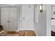 Hallway showcasing wood floors, neutral wall paint, and white doors in the home's interior at 400 W North St # 804, Raleigh, NC 27603