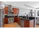 Modern kitchen area with stainless steel appliances and dark countertops at 400 W North St # 804, Raleigh, NC 27603