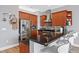 Open kitchen with stainless steel appliances, granite countertops, and a breakfast bar with seating at 400 W North St # 804, Raleigh, NC 27603