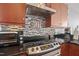 Modern kitchen features stainless steel appliances, granite countertops, and stylish backsplash at 400 W North St # 804, Raleigh, NC 27603