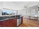 Open living space with a modern kitchen area, dining room, and city views at 400 W North St # 804, Raleigh, NC 27603