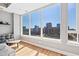 Bright living room with an open floor plan, showcasing city views through large windows at 400 W North St # 804, Raleigh, NC 27603
