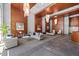 Spacious lobby area with cozy seating, contemporary lighting fixtures, and elegant wood paneling at 400 W North St # 804, Raleigh, NC 27603