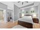 A serene main bedroom with neutral walls, wood floors, and natural light creates a peaceful retreat at 400 W North St # 804, Raleigh, NC 27603
