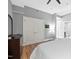 Main bedroom featuring hardwood floors, neutral decor, walk-in closet, and modern ensuite bathroom at 400 W North St # 804, Raleigh, NC 27603