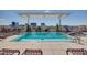 Rooftop pool with lounge chairs and city views at 400 W North St # 804, Raleigh, NC 27603