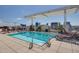 Rooftop pool with lounge chairs, shade, and city views at 400 W North St # 804, Raleigh, NC 27603