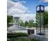 Serene fountain at the heart of Frantz Square, surrounded by benches and lush landscaping at 431 S Harrison Ave, Cary, NC 27511