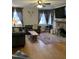 Inviting living room with a stone fireplace, comfortable seating, hardwood floors, and ample natural light at 431 S Harrison Ave, Cary, NC 27511