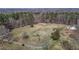 Beautiful aerial view of fenced acreage with lots of trees at 4420 Bunton Swaim Rd, Liberty, NC 27298