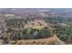 Overhead aerial view of property surrounded by lush trees at 4420 Bunton Swaim Rd, Liberty, NC 27298