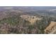 Overhead view of private home and property surrounded by woods at 4420 Bunton Swaim Rd, Liberty, NC 27298