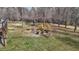 Expansive backyard featuring a fire pit surrounded by seating, ideal for gatherings at 4420 Bunton Swaim Rd, Liberty, NC 27298